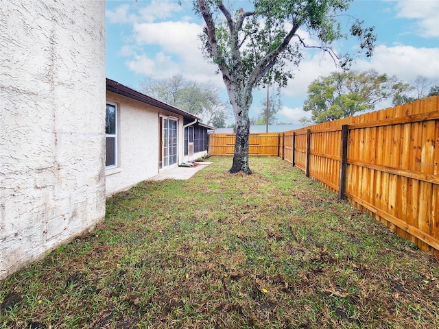 view of yard with a fenced backyard