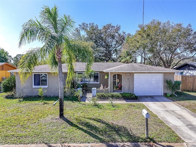 ranch-style home with a garage and a front yard