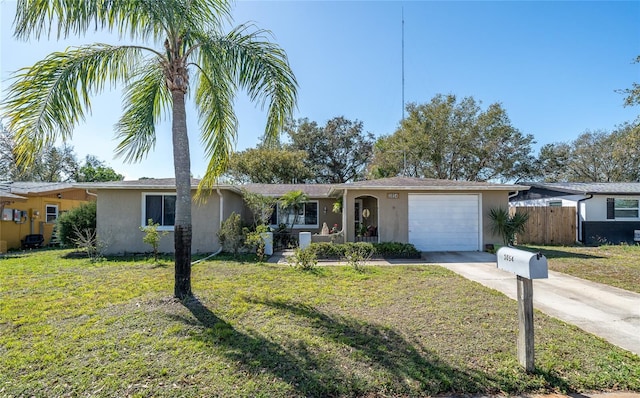 ranch-style home featuring a garage and a front lawn