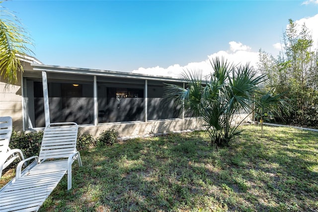 view of yard featuring a sunroom