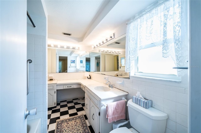 full bathroom with shower / tub combination, vanity, toilet, and tile walls