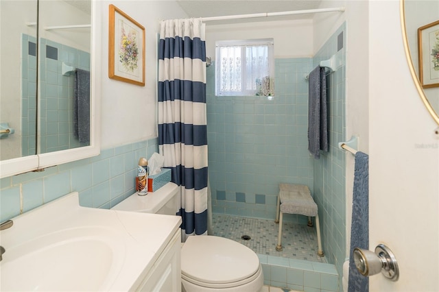 bathroom with vanity, curtained shower, and toilet