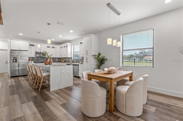 dining space featuring hardwood / wood-style flooring