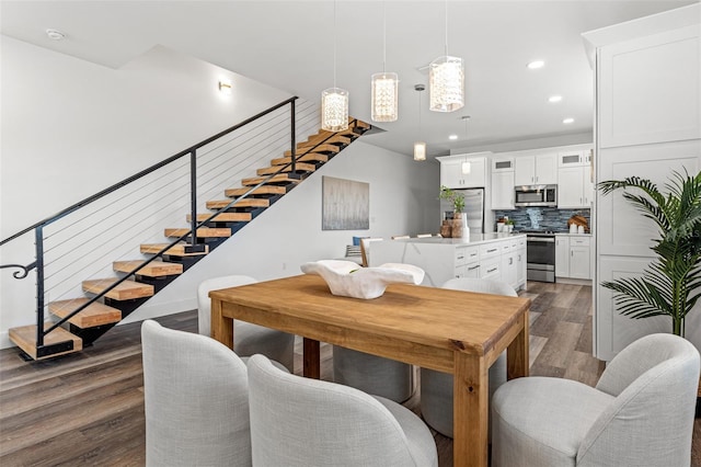 6207 64th Way N, Pinellas Park, FL 33781 - dining room with stairway, dark wood-type flooring, and recessed lighting
