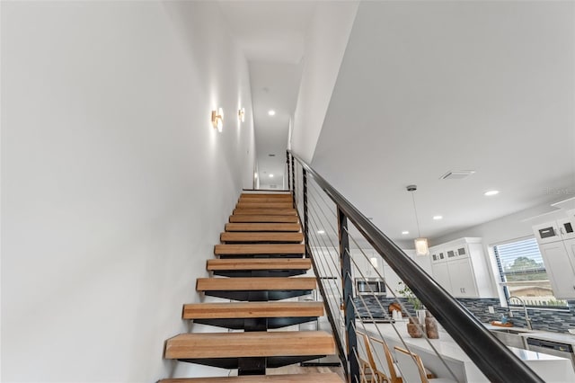 6207 64th Way N, Pinellas Park, FL 33781 - staircase featuring recessed lighting
