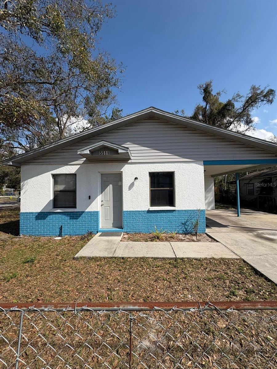 view of front facade with a carport