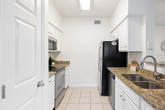 kitchen featuring white cabinetry, sink, and appliances with stainless steel finishes