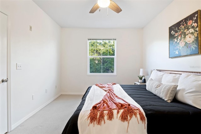 bedroom featuring ceiling fan and light carpet