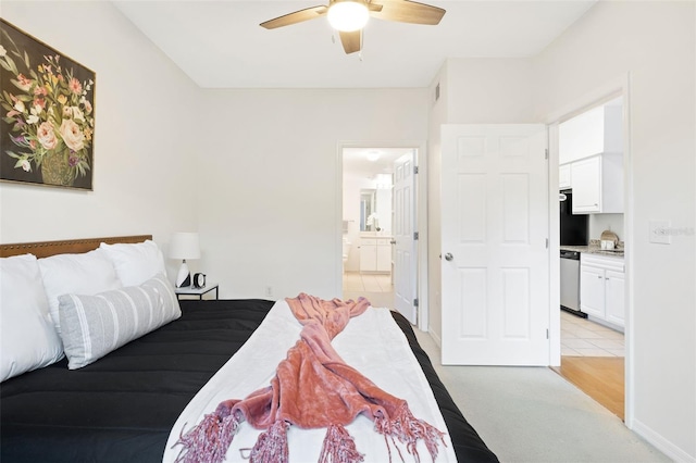 carpeted bedroom featuring ensuite bath and ceiling fan