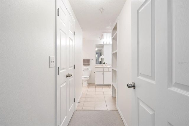 hallway featuring light tile patterned floors