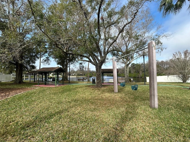 view of yard featuring a gazebo and a water view