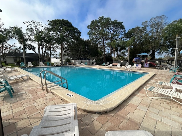 view of swimming pool with a patio