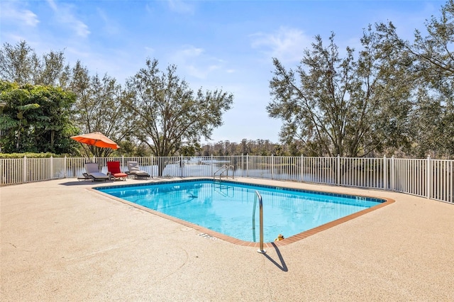 view of swimming pool with a patio