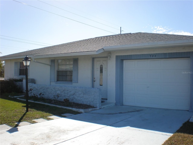 single story home featuring a garage