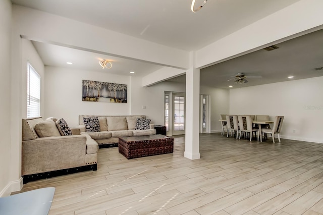 living room with ceiling fan, recessed lighting, visible vents, baseboards, and light wood finished floors