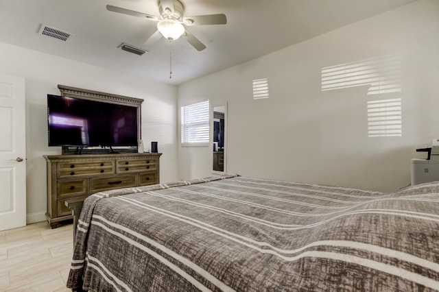 bedroom with visible vents and a ceiling fan