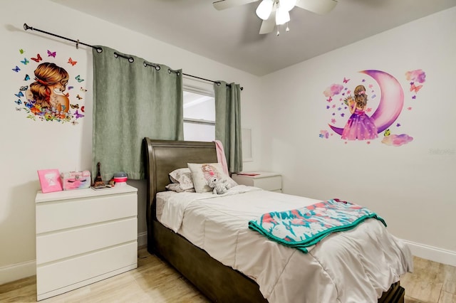 bedroom featuring light wood-type flooring, ceiling fan, and baseboards