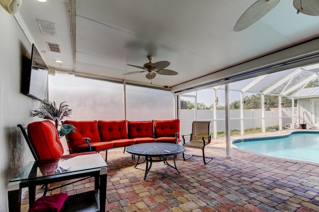 sunroom featuring visible vents and a ceiling fan