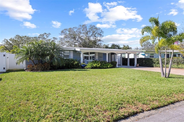 single story home featuring a carport and a front lawn