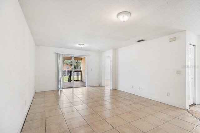 spare room with light tile patterned floors