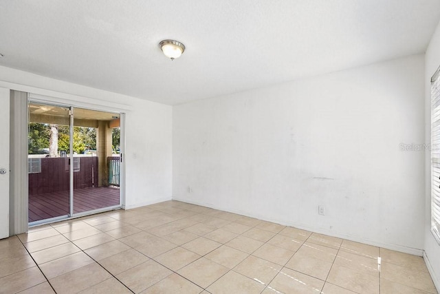 spare room featuring light tile patterned floors