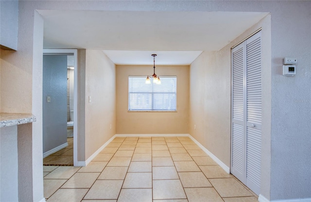 unfurnished dining area with light tile patterned floors