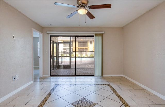 tiled empty room with ceiling fan