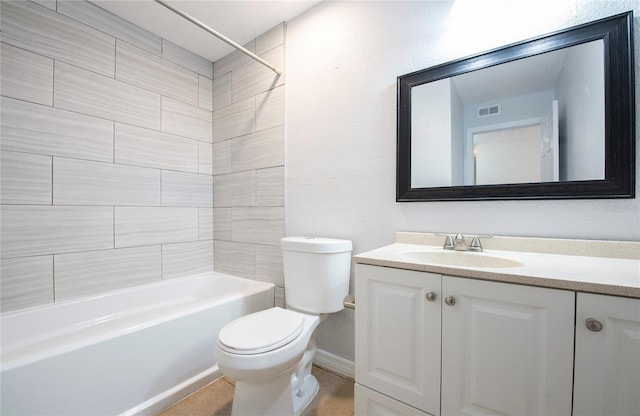 full bathroom featuring vanity, toilet, and tiled shower / bath combo