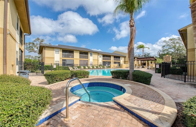 view of pool featuring a hot tub