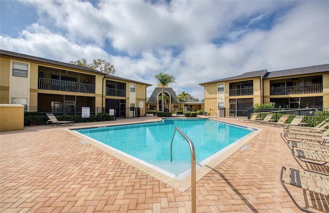 view of swimming pool featuring a patio area