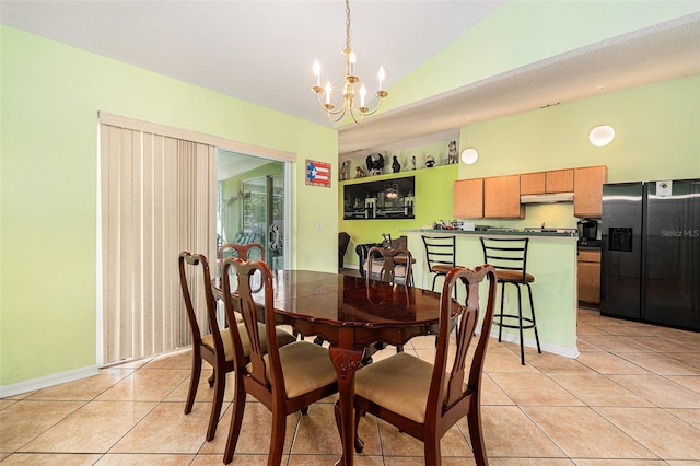 tiled dining room featuring lofted ceiling, a chandelier, and a textured ceiling