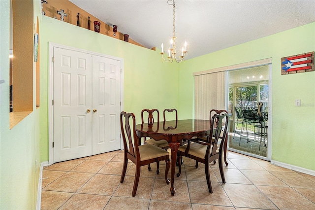 dining room featuring vaulted ceiling, light tile patterned floors, and an inviting chandelier