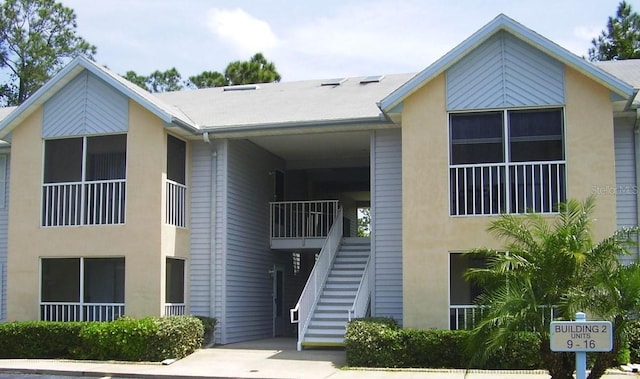 view of property featuring stairs