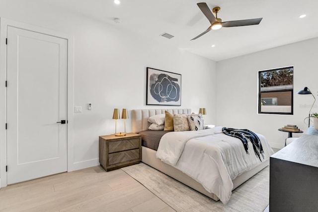 bedroom featuring ceiling fan and light hardwood / wood-style flooring