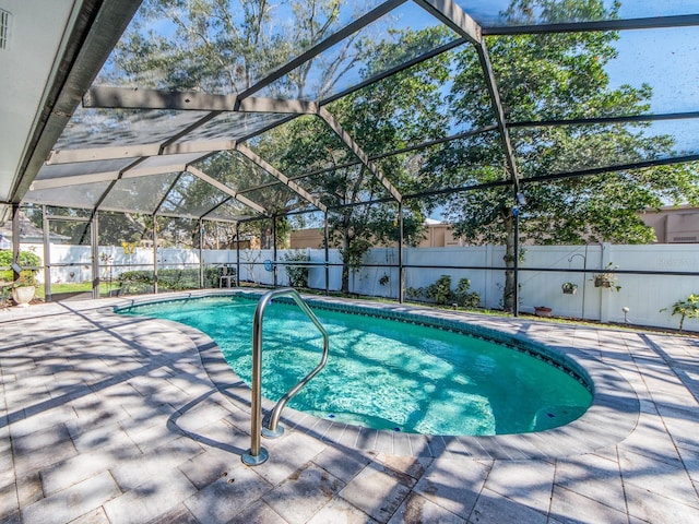 view of pool with a fenced in pool, a fenced backyard, and a patio area