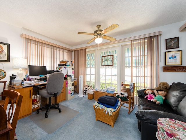 office featuring carpet floors, a textured ceiling, and ceiling fan