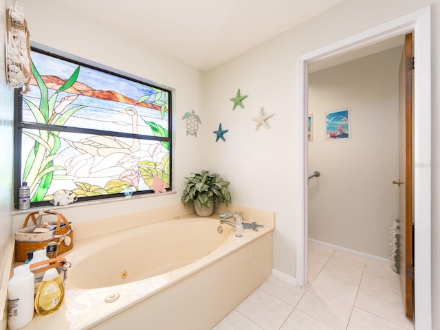 full bathroom featuring tile patterned floors, baseboards, and a garden tub