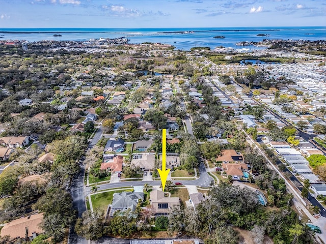 birds eye view of property with a residential view and a water view