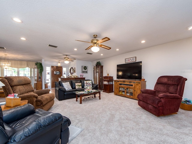 2893 Turtle Ter, Palm Harbor, FL 34683 - carpeted living area with ceiling fan, recessed lighting, a chandelier, and a textured ceiling