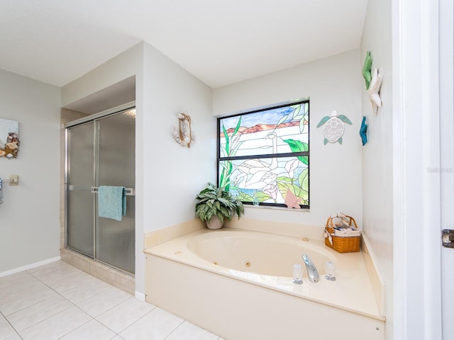 2893 Turtle Ter, Palm Harbor, FL 34683 - bathroom with a shower stall, tile patterned floors, and a tub with jets