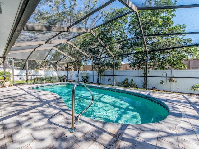2893 Turtle Ter, Palm Harbor, FL 34683 - view of swimming pool with a patio, a fenced backyard, and a lanai