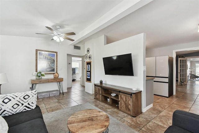 tiled living room featuring ceiling fan