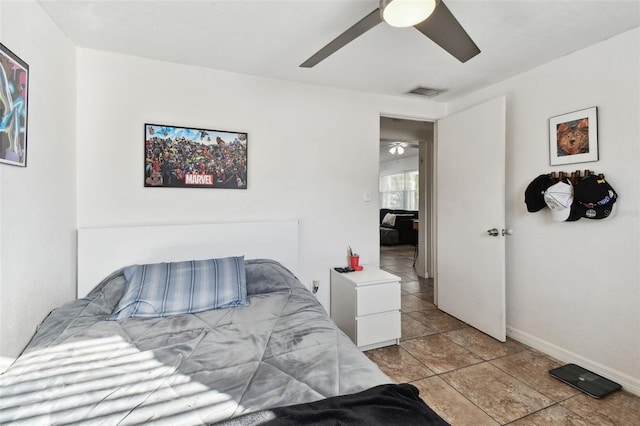 bedroom with light tile patterned floors and ceiling fan