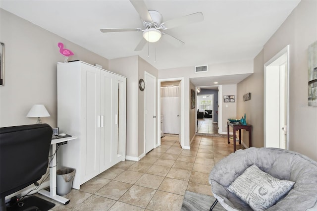 office area with ceiling fan and light tile patterned flooring