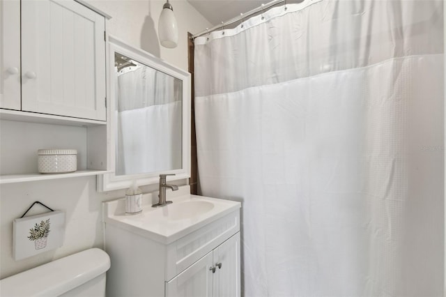 bathroom with vanity and toilet