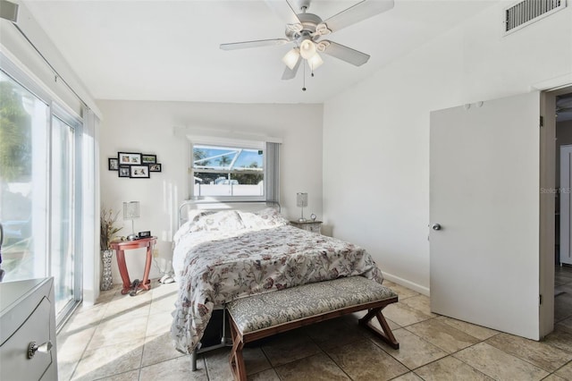 bedroom with light tile patterned flooring, lofted ceiling, and ceiling fan