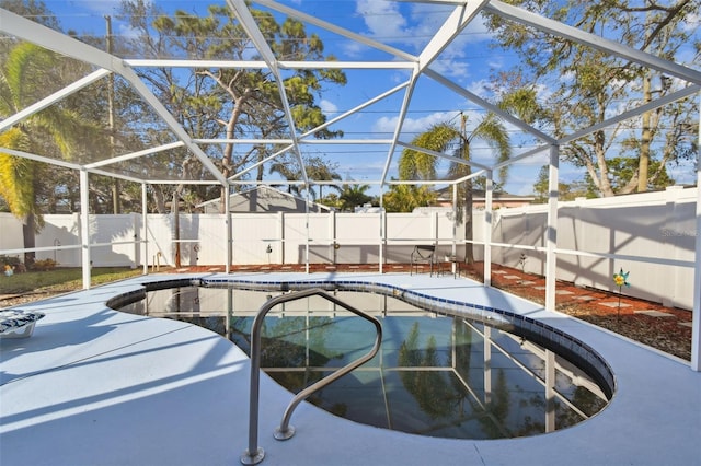 view of swimming pool featuring a lanai and a patio