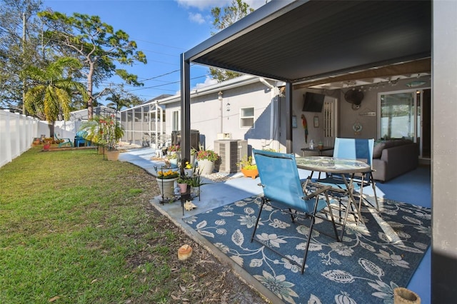 view of patio / terrace with central AC unit and a lanai