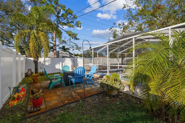 view of patio with glass enclosure