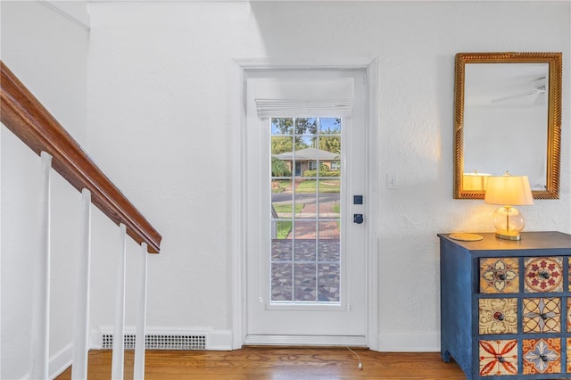 doorway to outside with hardwood / wood-style flooring